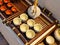 Chinese white teapot and teacups on the wooden trivet