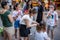 Chinese woman braiding friends hair