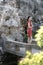 Chinese woman in cheongsam by a fountain in Mudu ancient town