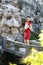 Chinese woman in cheongsam by a fountain in Mudu ancient town