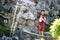 Chinese woman in cheongsam by a fountain in Mudu ancient town