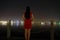 Chinese woman in cheongsam by Jinji lake at beautiful cool night