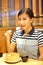 Chinese Woman eating Steamed dumpling in restaurant