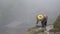 Chinese woman farming on side of a mountain