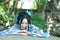 Chinese woman in traditional Blue and white Hanfu dress Climb over the stone table