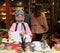 Chinese Woman with traditional dress preparing green tea ceremony