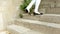 Chinese woman walking up a stone stairway in slow motion in Guilin