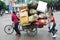 Chinese women carry goods