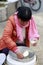 Chinese women trader sell doufunao ( jellied bean curd )