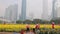 Chinese workers plant yellow flowers in the city center