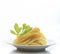 Chinese yellow eggs noodle on white disk with green leaves of ce