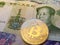 Chinese yuan renminbi currency and bitcoin crypto currency concept coin finance new currency concept