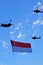 Chinook flying Singapore flag during NDP