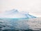 Chinstrap penguins on slope of iceberg near Spert Island northwest of Antarctic Peninsula, Antarctica