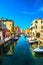 Chioggia town in venetian lagoon, water canal and church. Veneto, Italy