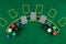 Chips cards lie on a green blackjack table top view. Casino concept, gambling