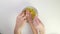 Chips for the family. Top view plate with chips. Caucasian hands take a snack from a bowl. The concept of fast food