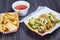 Chips red salsa street taco meal 3 corn tortilla lengua cow beef tongue Mexican lime wedge