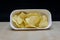 Chips in White Square Bowl on Table, Heap of Wafers, Side View