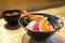 Chirashi sushi, Japanese food, rice bowl with raw salmon sashimi, scallop, shrimp, surf clam, salmon eggs, octopus, tuna