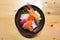 Chirashi sushi, Japanese food rice bowl with raw salmon sashimi, tuna, and other mixed seafood, top view, center aligned with copy