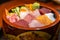 Chirashizushi is known as scattered sushi and is served on bowls with colorful toppings