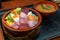 Chirashizushi is known as scattered sushi and is served on bowls with colorful toppings