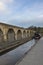 Chirk aqueduct and viaduct on the Llangollen canal, on the border of England and Wales. With a barge crossing