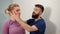 Chiropractic adjustment. Woman suffering from neck pain. Professional massage