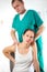 Chiropractor massage the female patient spine and back