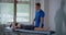 Chiropractor is working with female patient in rehab center,treat musculoskeletal pain