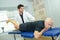 Chiropractor working on patient`s leg