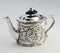 Chiselled silver teapots