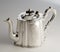 Chiselled silver teapots