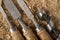 Chisels and wood drills laid on sawdust. Carpentry accessories in the workshop