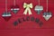 Chistmas welcome sign with red and green hearts and gold bow on wooden door