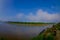 CHITWAN, NEPAL - NOVEMBER 03, 2017: Unidentified people canoeing safari on wooden boats Pirogues on the Rapti river