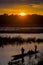 CHITWAN, NEPAL - NOVEMBER 03, 2017: Unidentified people enjoying the beautiful sunset while they are canoeing safari on