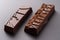 chocolate bar, cut in half to reveal steps of its creation