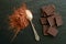 Chocolate bars with heap of cacao powder