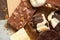 Chocolate bars and homemade candies on rustic table, sweet food, macro photo
