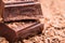 Chocolate bars on a wooden background. Chocolate candies.