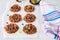 Chocolate bird`s nest cookies decorated with colorful candies on