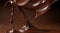 chocolate on a brown background, liquid chocolate on abstract backgroumd, pouring chocolate on brown background