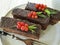 Chocolate brown cake, red currant, mint tasty cutting baked dish seasoning pastry plate on white wooden