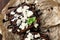 Chocolate brownie cake, dessert with nuts on dark background, directly above