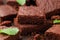 Chocolate brownies garnished with mint. Sweet food