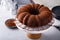 Chocolate bundt cake dusted with cocoa powder