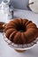 Chocolate bundt cake dusted with cocoa powder