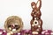 Chocolate bunny and nest with easter almond eggs on table with white background